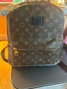 Louis Vuitton Monogram Canvas Backpack in Brown and Gold Hardware